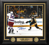 An autographed 11x14 framed sports photo print of Boston Bruins star Fraser Minten making a slapshot, with a player's signature in blue ink at the bottom.