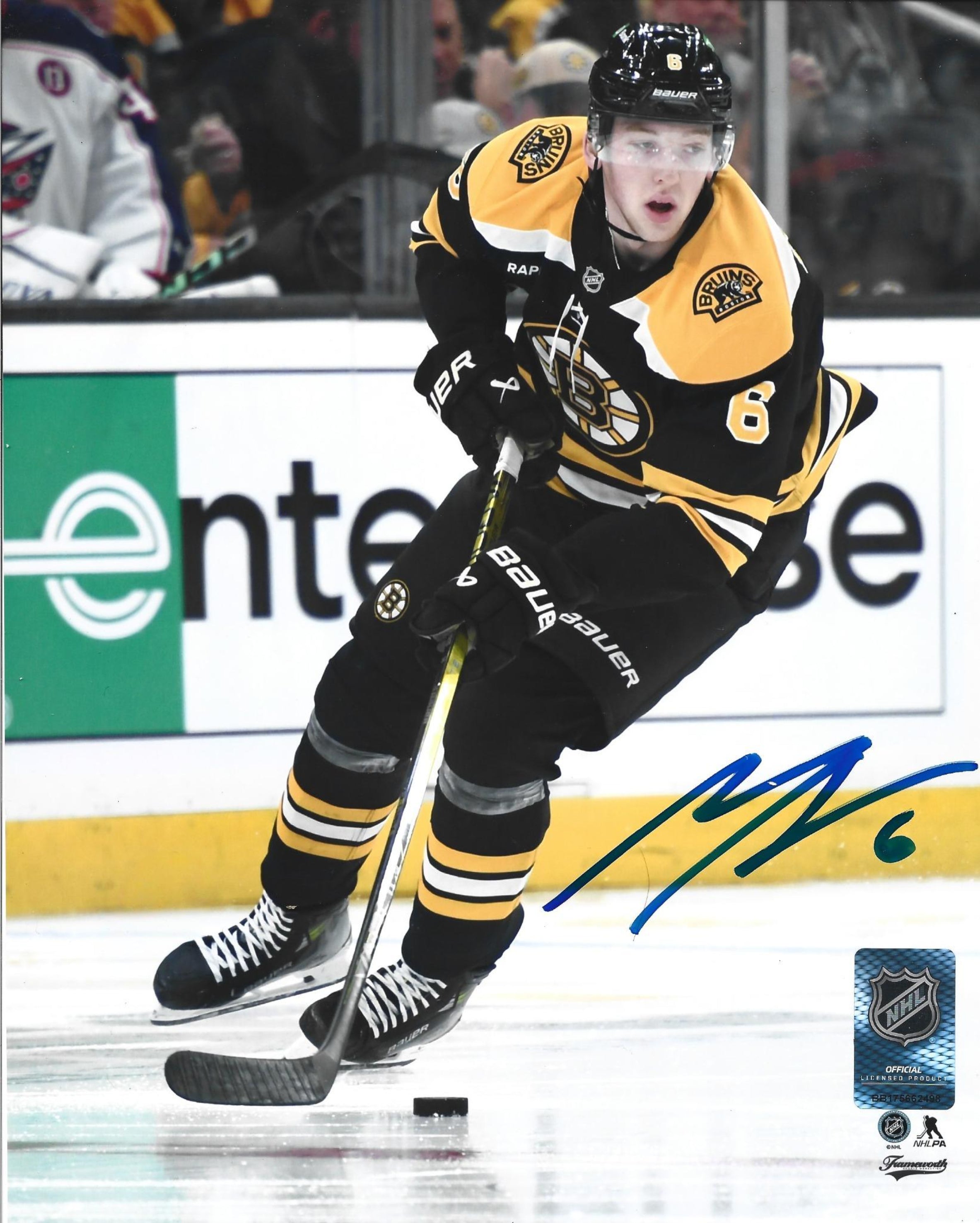 Mason Lohrei in Action Boston Bruins Autographed 8" x 10" Hockey Photo