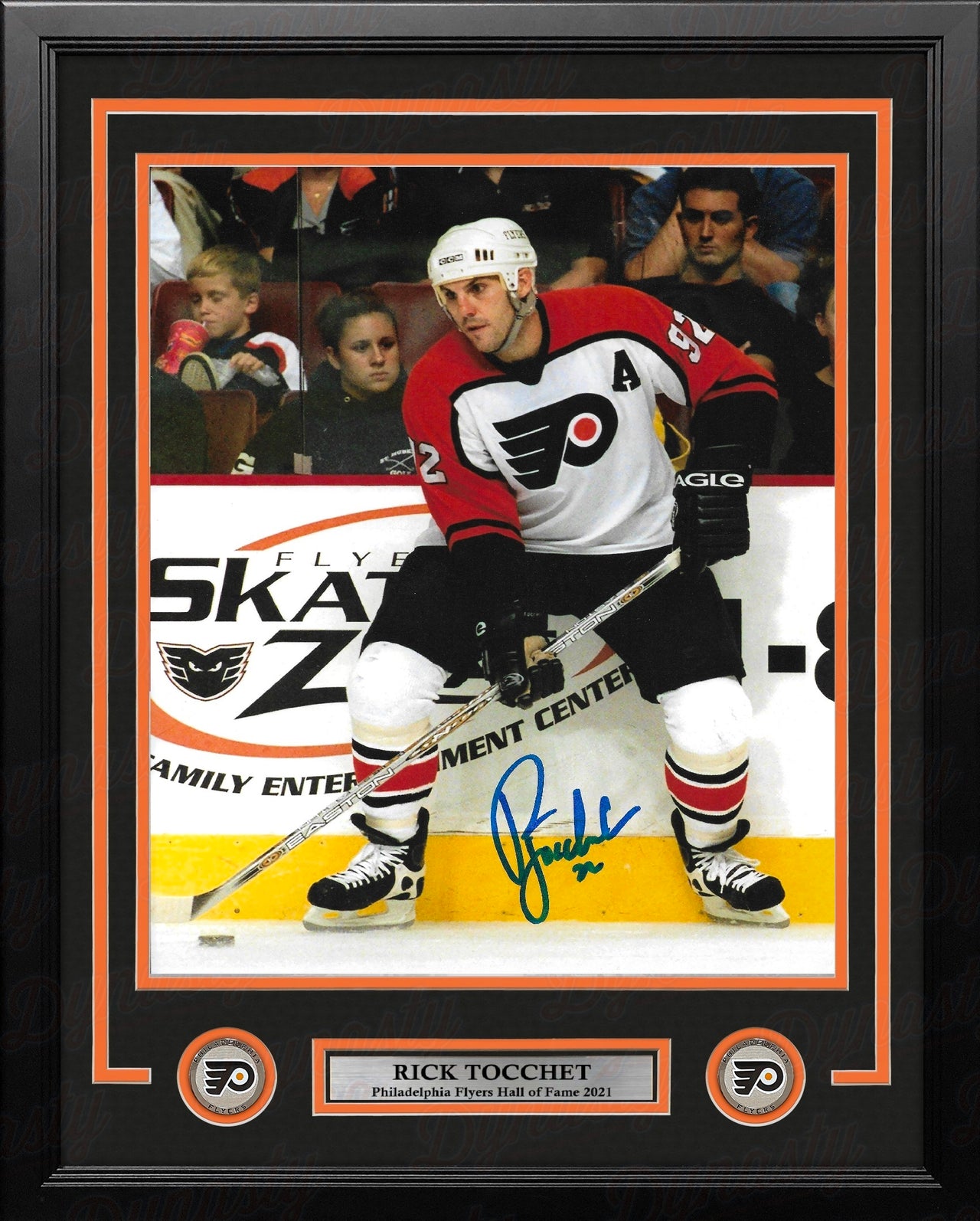 Philadelphia Flyers legend Rick Tocchet in action with a visible signature on the photo in a professional frame with nameplate