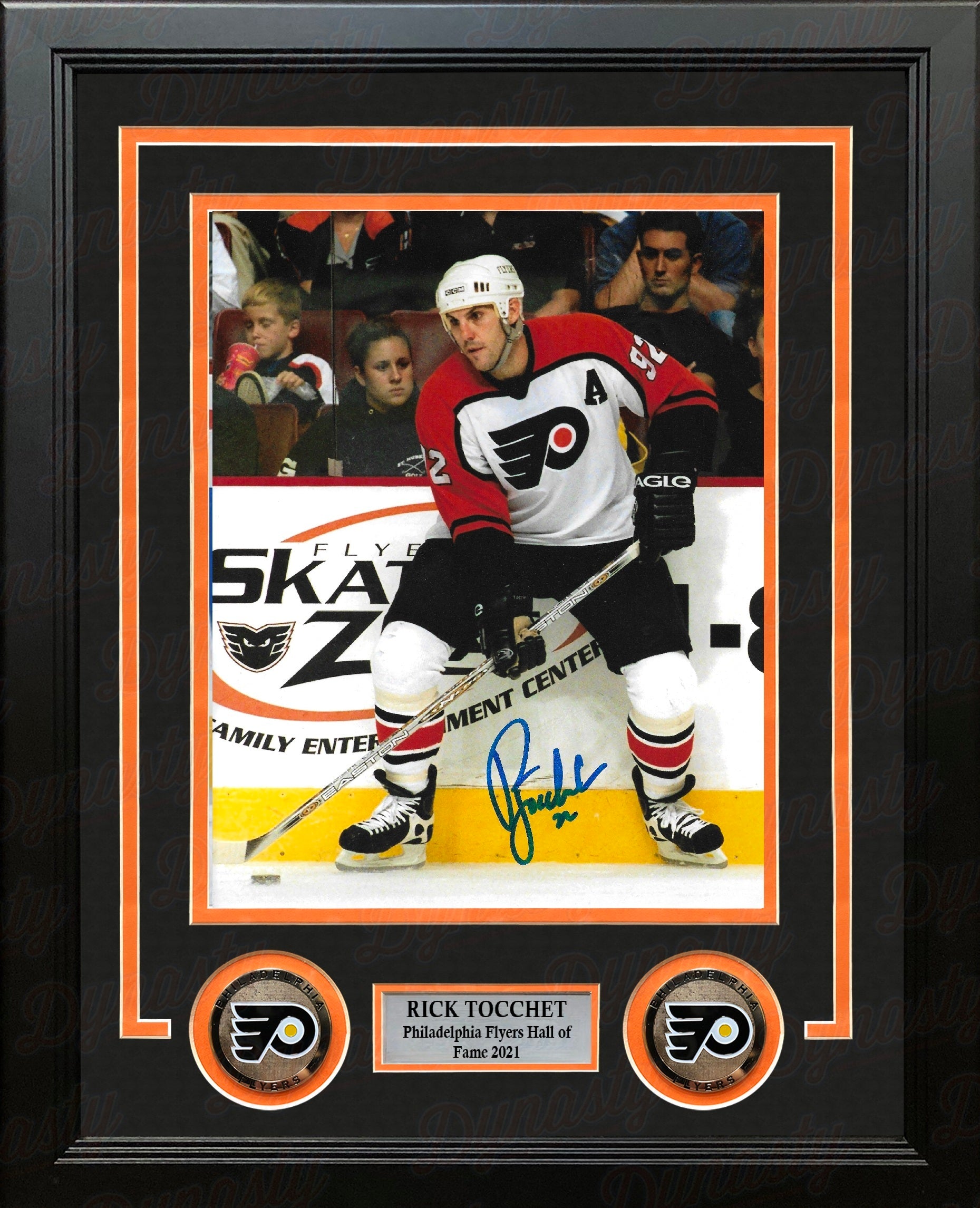 Philadelphia Flyers legend Rick Tocchet in action with a visible signature on the photo in a professional frame with nameplate