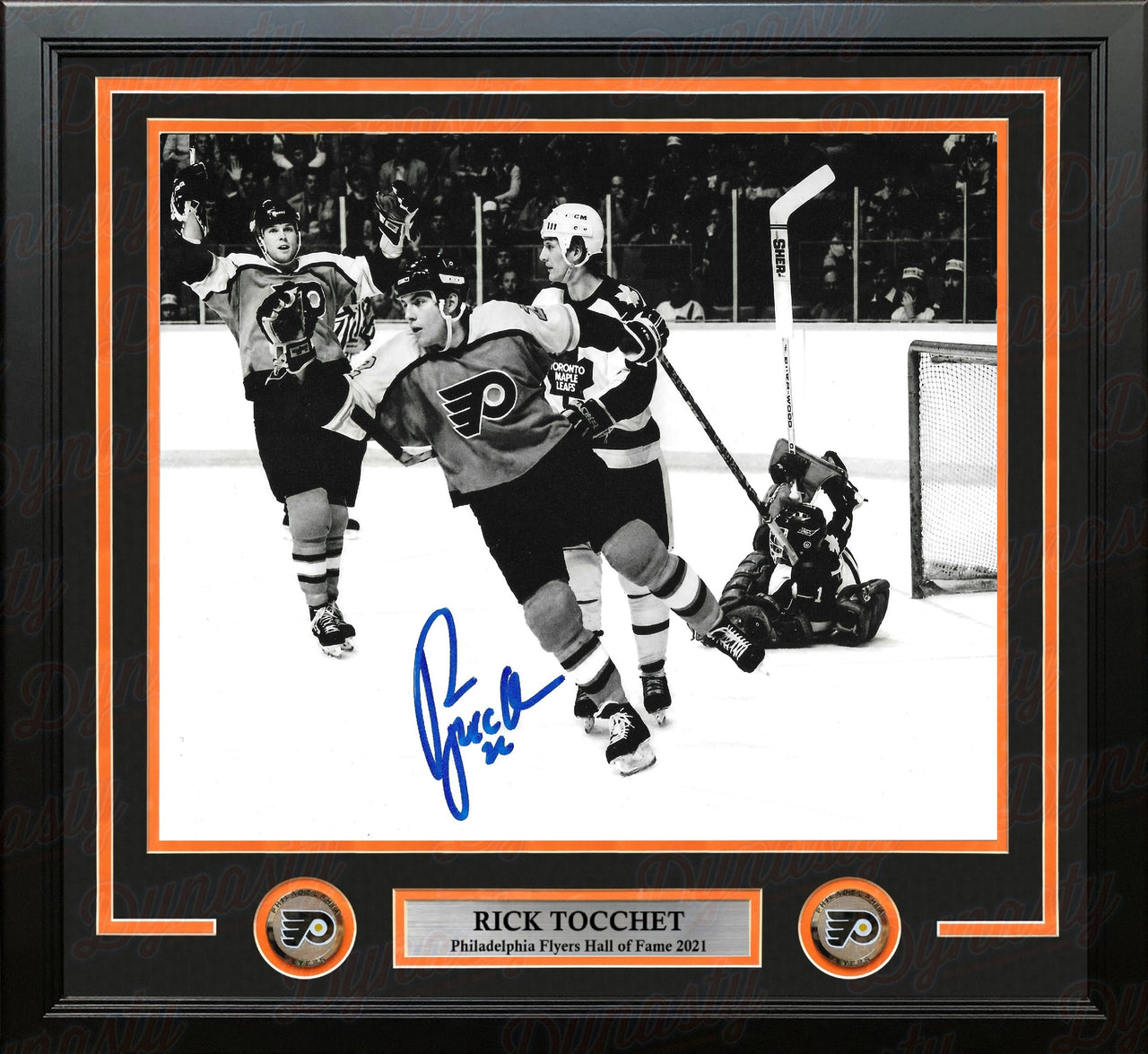 Philadelphia Flyers legend Rick Tocchet celebrating a goal with a visible signature on the photo in a professional frame with nameplate