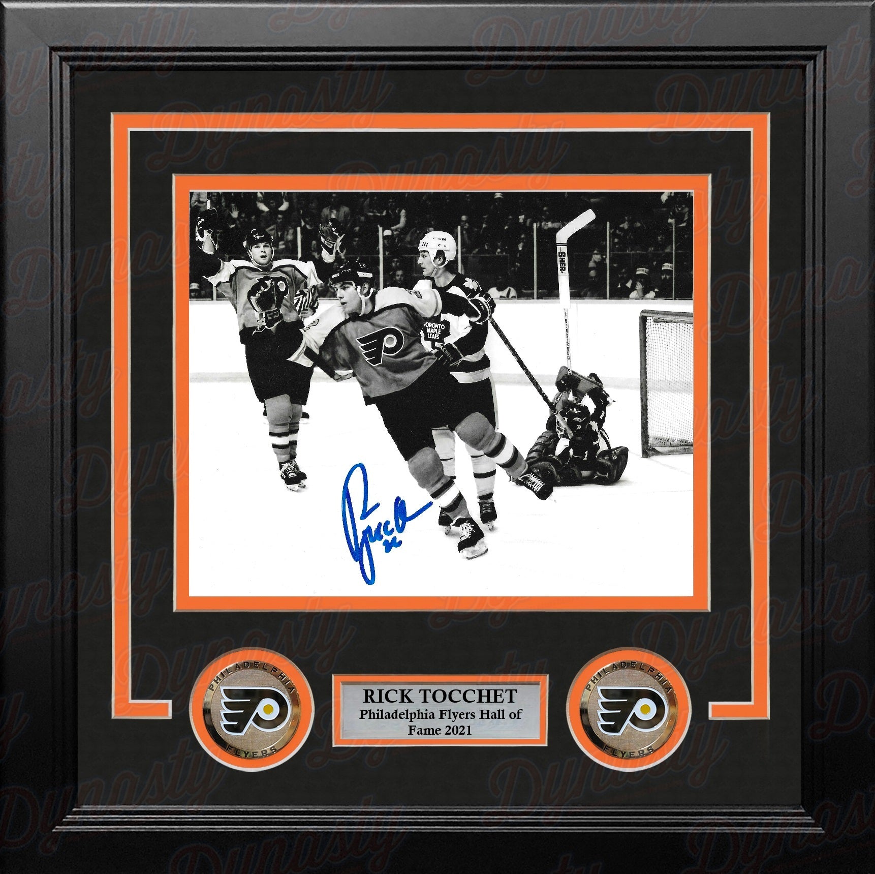 Philadelphia Flyers legend Rick Tocchet celebrating a goal with a visible signature on the photo in a professional frame with nameplate