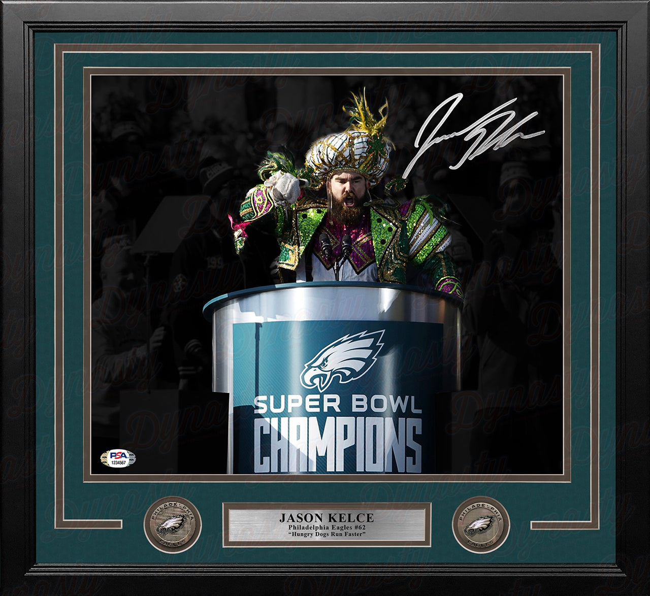 A framed Jason Kelce Philadelphia Eagles Super Bowl Champions display featuring a signed photo of Jason Kelce at the podium, a dark green mat, two circular Eagles emblems, and a silver nameplate.