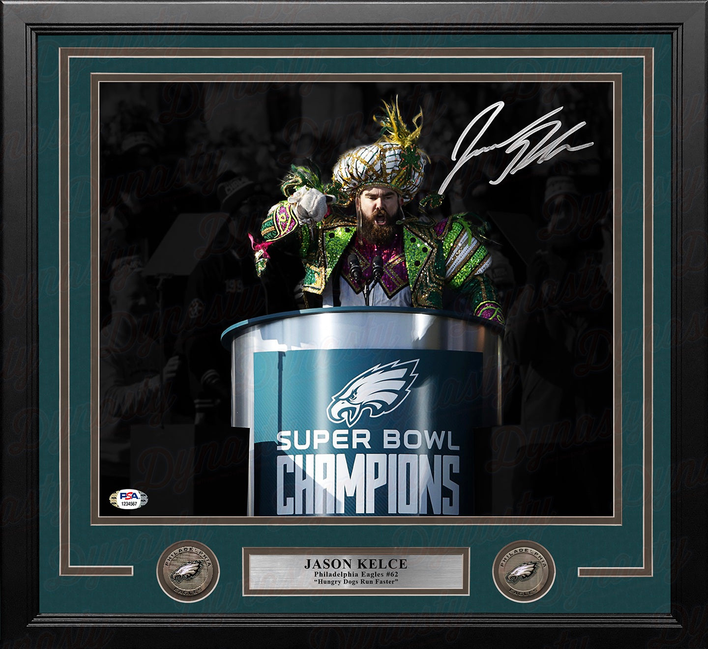 A framed Jason Kelce Philadelphia Eagles Super Bowl Champions display featuring a signed photo of Jason Kelce at the podium, a dark green mat, two circular Eagles emblems, and a silver nameplate.