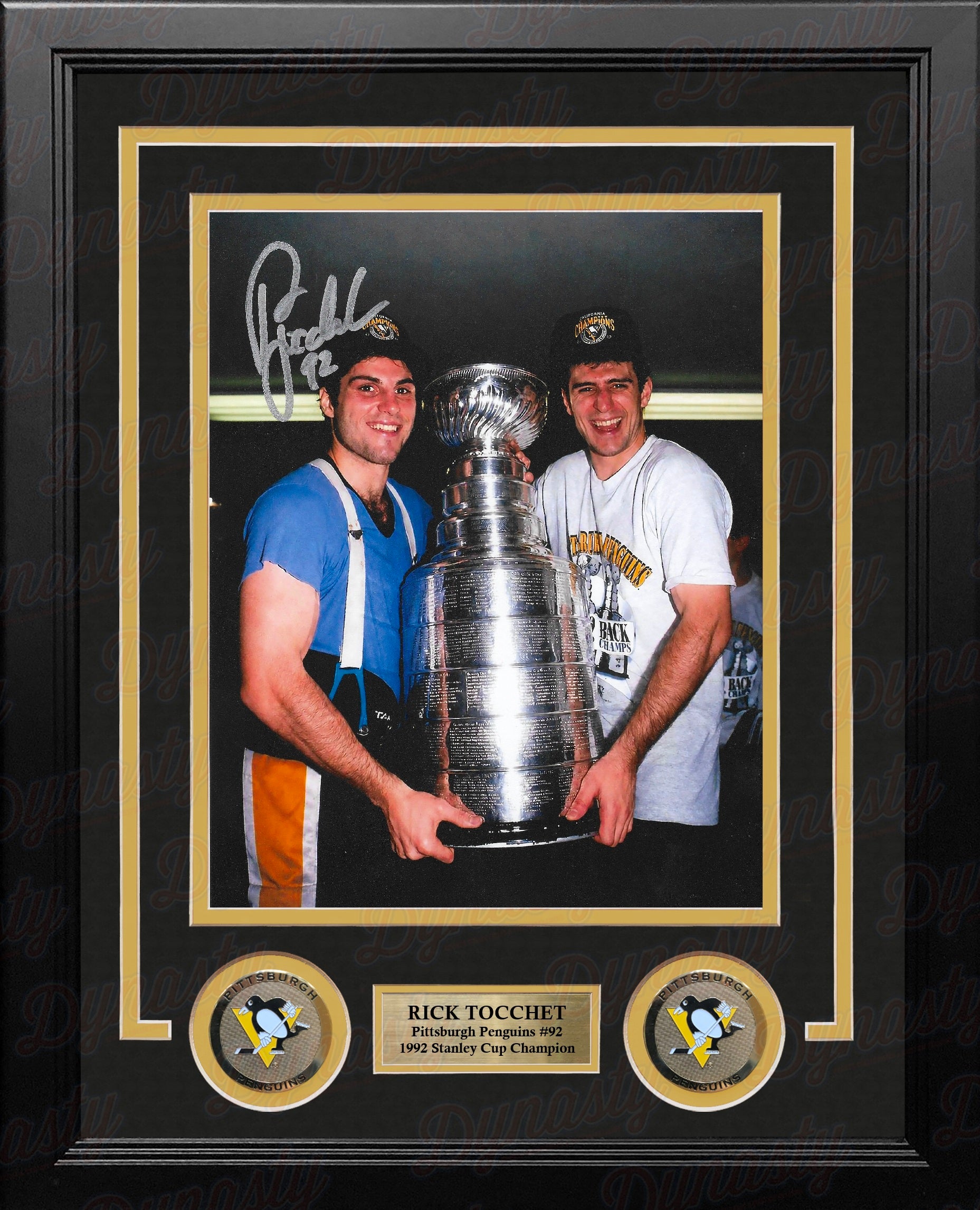 Pittsburgh Penguins legend Rick Tocchet celebrating with the Stanley Cup in 1992 with a visible signature on the photo in a professional frame with nameplate