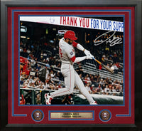 Framed 11x14 baseball memorabilia featuring a signed action photo of Derrek Hill, Philadelphia Phillies #49, batting at the plate. The print is matted with a dark red and blue double border and a black frame, with a gold nameplate and two circular team emblems at the bottom.