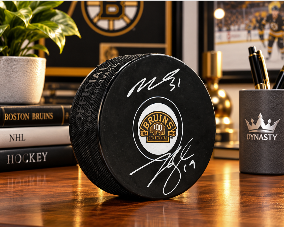 Matthew Poitras & Johnny Beecher Autographed Boston Bruins 100th Anniversary Hockey Logo Puck