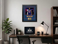 Framed photo of Philadelphia 76ers superstar LeBron James with engraved nameplate, laser-engraved replica autograph, and 76ers themed matting and trim. The photo is hanging in an office.