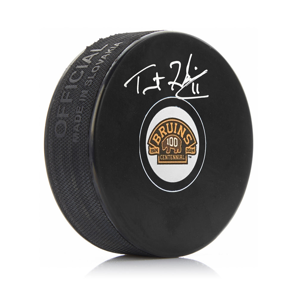 Trent Frederic Autographed Boston Bruins 100th Anniversary Hockey Logo Puck