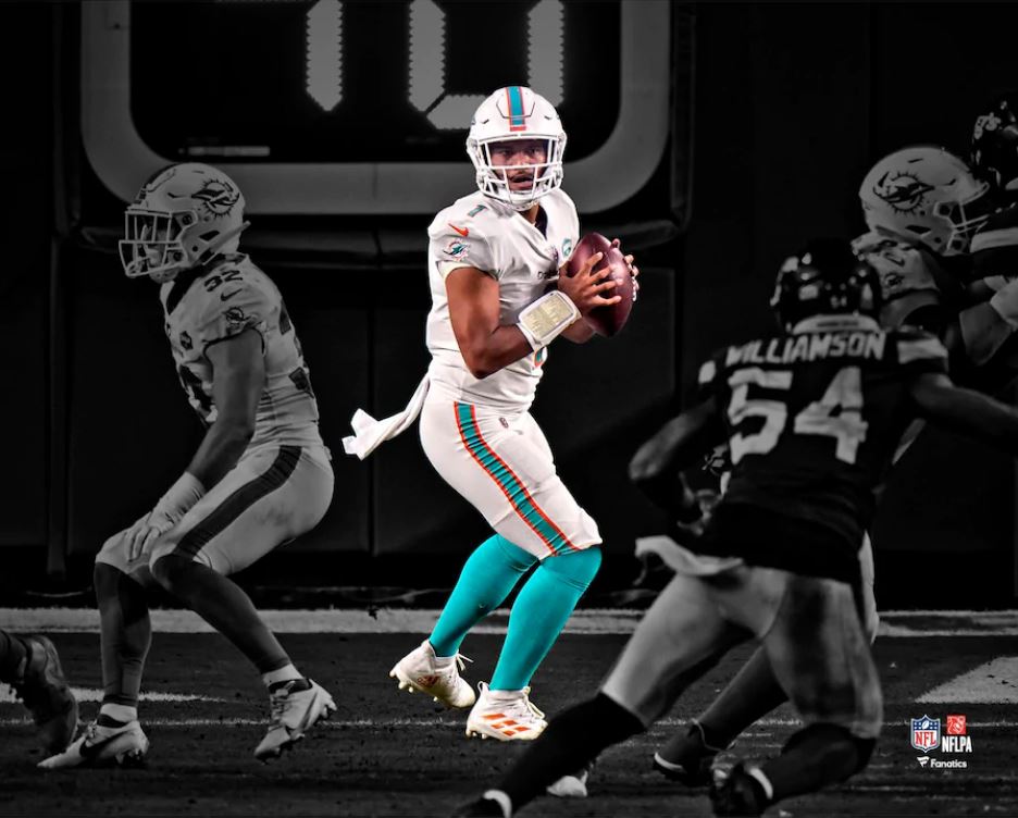 Tua Tagovailoa in Action Miami Dolphins 8" x 10" Blackout Football Photo - Dynasty Sports & Framing 