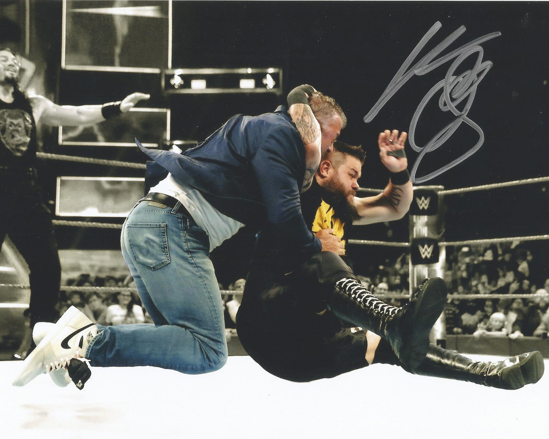 Kevin Owens Autographed WWE Wrestling Stunning Shane McMahon Photo - Dynasty Sports & Framing 